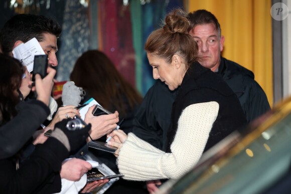 Celine Dion et sa famille à la sortie de leur hôtel à Paris, le 7 décembre 2013.