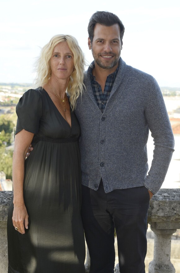 Sandrine Kiberlain et Laurent Lafitte posant au photocall du film "Elle l'adore" lors 7ème Festival du Film Francophone d'Angoulême, à Angoulême, le 23 août 2014.