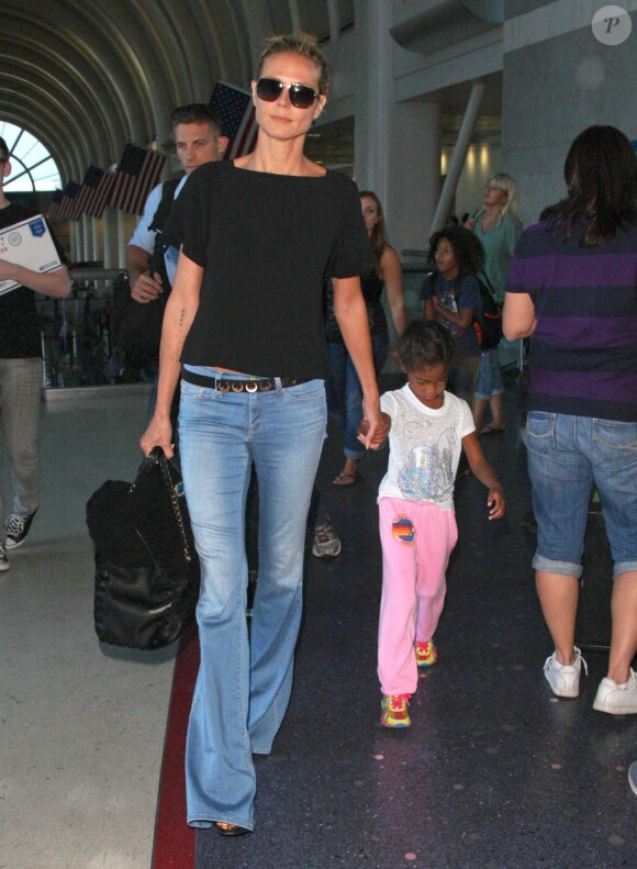Heidi Klum et ses enfants Leni, Lou et Johan arrivent à l'aéroport de Los Angeles  New York, le 28 août 2014.