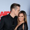 Ashley Tisdale et son époux Christopher French lors de la projection de "Scary Movie 5" au Cinerama Dome de Los Angeles, le 11 avril 2013