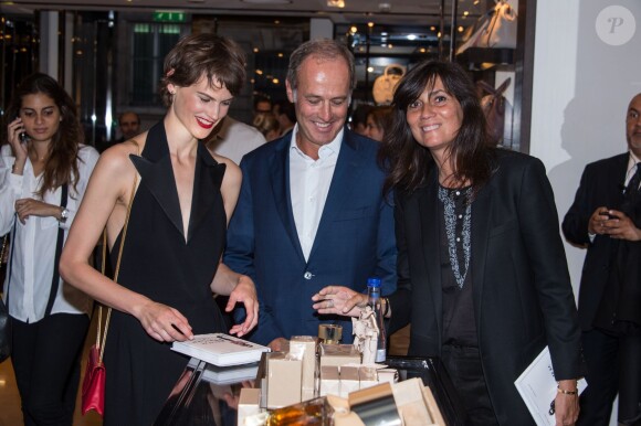 Saskia de Brauw, Xavier Romatet et Emmanuelle Alt lors de la Vogue Fashion Night Out 2014 à Paris, le 16 septembre 2014.