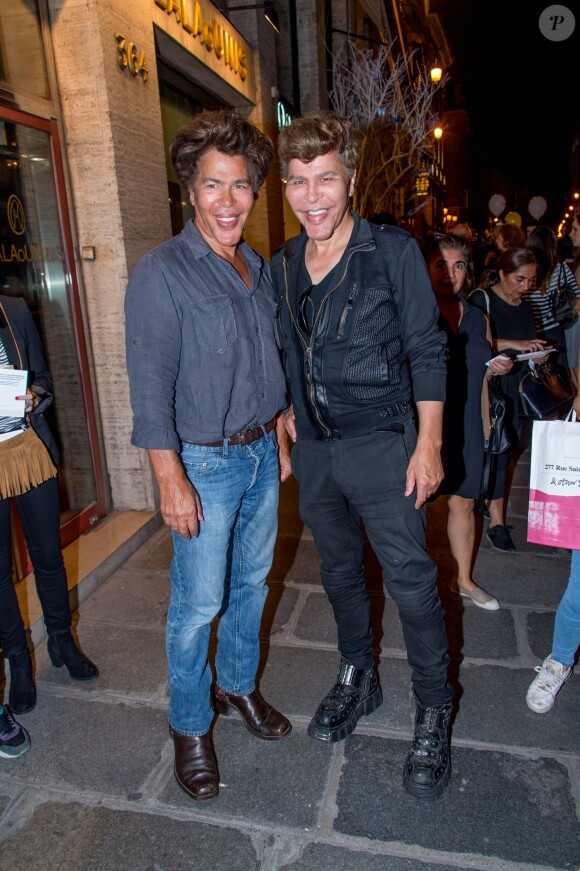 Igor et Grichka Bogdanoff lors de la Vogue Fashion Night Out 2014 à Paris, le 16 septembre 2014.