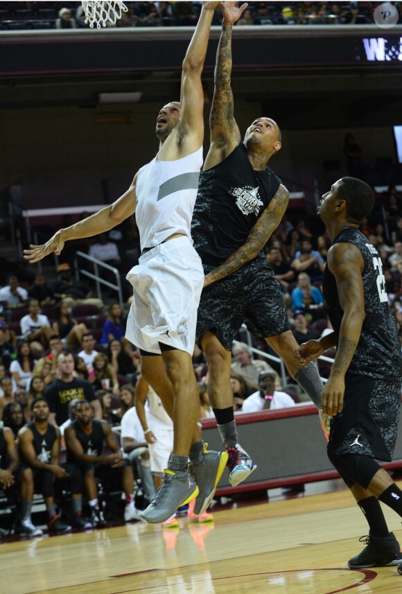 Chris Brown participe au match de basket-ball caritatif Power 106 All-Star à l'USC Galen Center. Los Angeles, le 21 septembre 2014.