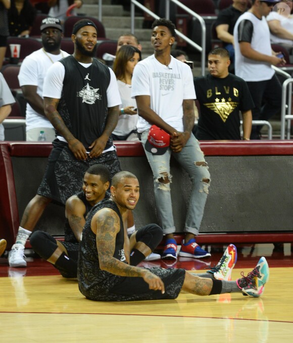Chris Brown, Trey Songz, The Game et Nick Young lors du match de basket-ball caritatif Power 106 All-Star à l'USC Galen Center. Los Angeles, le 21 septembre 2014.