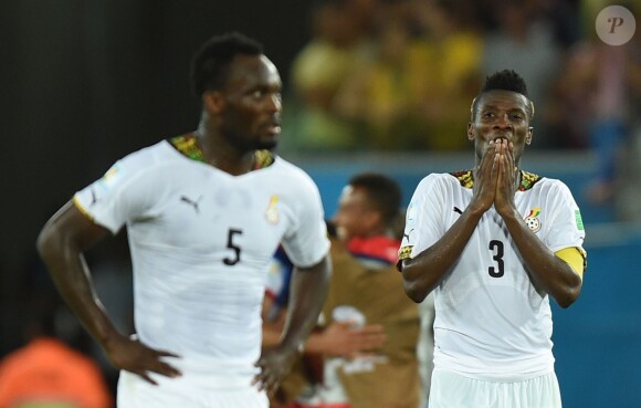 Michael Essien et Asamoah Gyan après le match entre le Ghana et les Etats-Unis à l'Estadio Arena das Dunas dans la ville de Natal, le 16 juin 2014 lors de la Coupe du monde