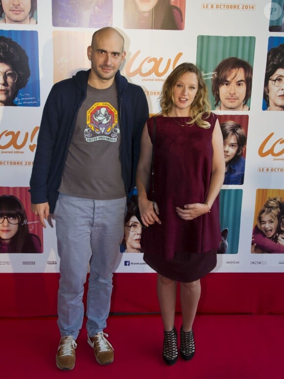 Julien Neel et Ludivine Sagnier, enceinte lors de l'avant-première du film "Lou ! Journal infime" au cinéma MK2 Bibliothèque à Paris, le 28 septembre 2014.