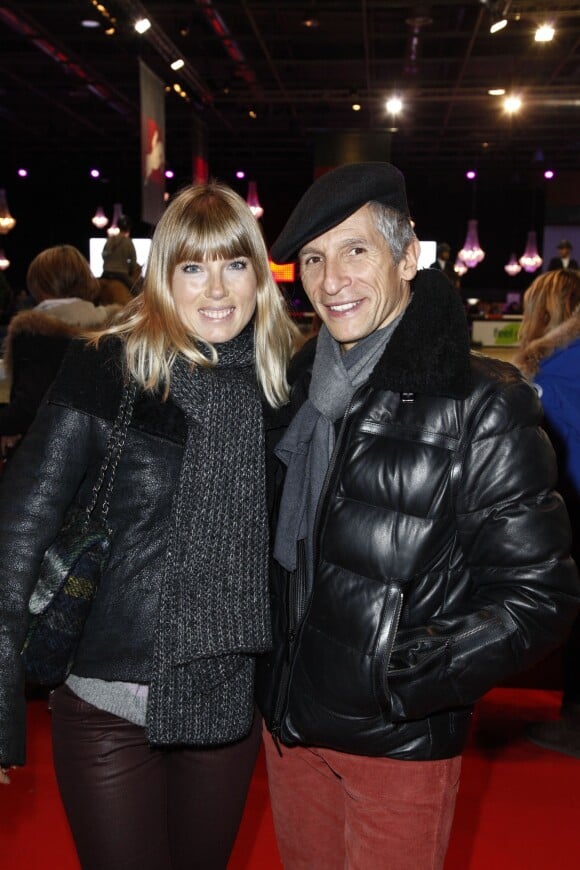 Nagui et sa femme Melanie Page - Dans le cadre du Gucci Paris Masters à eu lieu l'epreuve "Style & Competition for AMADE" à Villepinte le 7 décembre 2013.