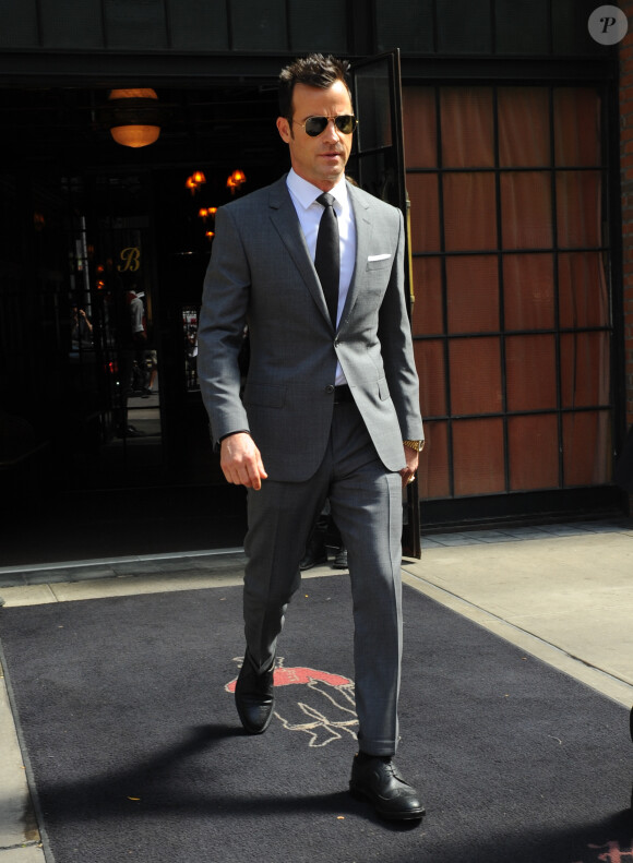 Justin Theroux quitte son hôtel à New York le 10 septembre 2014.