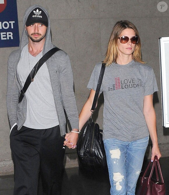 Ashley Greene et son petit-ami Paul Khoury arrivent à l'aéroport de Los Angeles en provenance de Chicago, le 3 août 2014. 