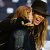 Cathy Guetta et son fils Tim Elvis lors du match PSG-APOEL Nicosie à Paris le 5 novembre 2014.