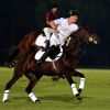 Le prince Harry lors du match de polo caritatif Sentebale Polo Cup le 20 novembre 2014 à Abu Dhabi.