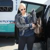 Amber Rose, stylée en veste en cuir, sac à dos Louis Vuitton et baskets Air Jordan (modèle Air Jordan 6 Retro "Sport Blue"). Los Angeles, le 16 septembre 2014.
