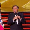 Jean-Pierre Foucault et Flora Coquerel (Miss France 2014) lors de la cérémonie de Miss France 2015 sur TF1, le samedi 6 décembre 2014.