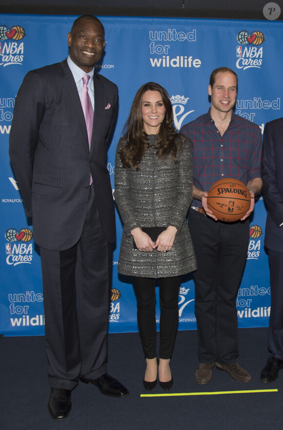 Catherine Kate Middleton, la duchesse de Cambridge, enceinte et le prince William assistent à un match de la NBA opposant les Brooklyn Nets et les Cleveland Cavaliers, à New York, le 8 décembre 2014. Le match soutient l'association "United for Wildlife". Le couple a rencontré LeBron James et Adam Silver.