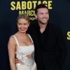 Lara Bingle et son compagnon Sam Worthington lors de la première du film "Sabotage" au cinéma "The Regal " à Los Angeles, le 19 mars 2014.19/03/2014 - Los Angeles