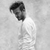 David Beckham pose en pull et boxer de la nouvelle collection de sa ligne de vêtements, David Beckham Bodywear pour H&M.