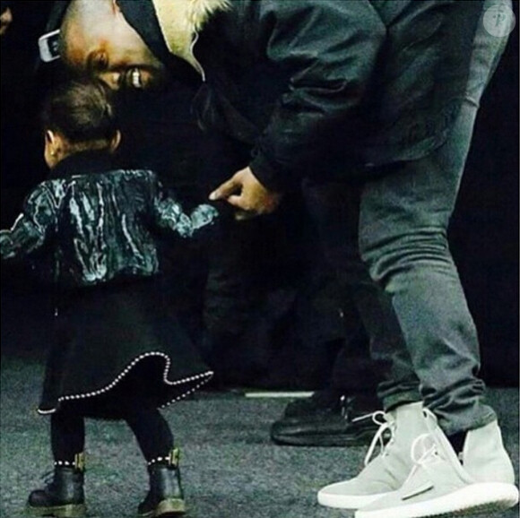 North et Kanye West arrivent au défilé Alexander Wang automne-hiver 2015 au Pier 36. New York, le 14 février 2015.