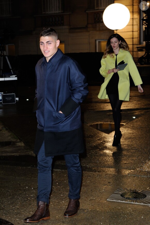 Marco Verratti et sa compagne enceinte Laura lors du défilé Valentino à l'Hötel Salomon de Rothschild à Paris, le 15 janvier 2014