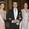 La princesse Victoria de Suède, son mari le prince Daniel de Suède et la princesse Madeleine de Suède, enceinte de son deuxième enfant, au palais royal le 11 février 2015 pour le premier dîner officiel de l'année.