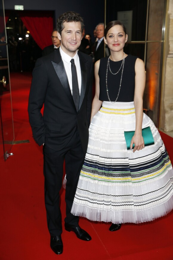 Guillaume Canet et sa compagne Marion Cotillard (robe Dior) arrivant à la 40ème cérémonie des Cesar au théâtre du Châtelet à Paris, le 20 février 2015.