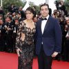 Michelle Rodriguez et le producteur Mohammed Al Turki - Montée des marches du film "Mad Max : Fury Road" lors du 68e Festival International du Film de Cannes le 14 mai 2015