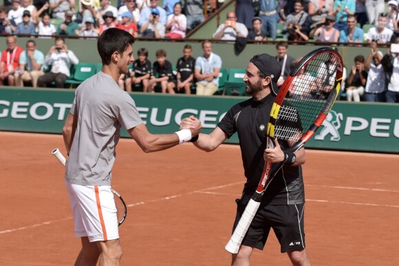 Novak Djokovic et  Cyril Hanouna lors du Kid's Day à Roland-Garros le 23 mai 2015 à Paris