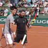 Novak Djokovic et Cyril lors du Kid's Day à Roland-Garros le 23 mai 2015 à Paris