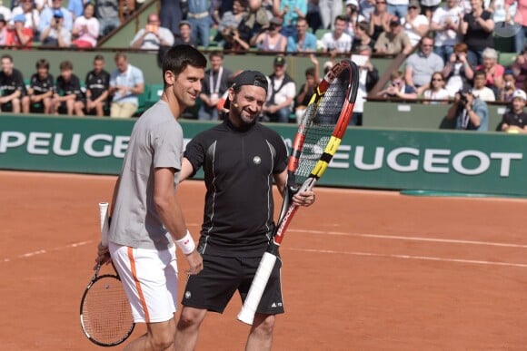 Novak Djokovic et Cyril lors du Kid's Day à Roland-Garros le 23 mai 2015 à Paris