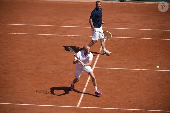 Guy FOrget et Cédric Pioline lors du Kid's Day à Roland-Garros le 23 mai 2015 à Paris