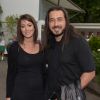 Moundir et sa belle épouse Inès, enceinte de leur premier enfant, posent au Village de l'edition 2015 du tournoi de tennis de Roland Garros à Paris, le 25 mai 2015