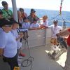 Les onze écoliers lauréats du concours Snapper pour tous organisé par la fondation Princesse Charlene de Monaco et l'Institut océanographique monégasque, le 10 juin 2015, lors de leur sortie en mer à bord du Yerson, qui leur a permis de voir des dauphins.