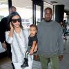 Kim Kardashian, Kanye West et leur fille North à Los Angeles, le 1er septembre 2014. 