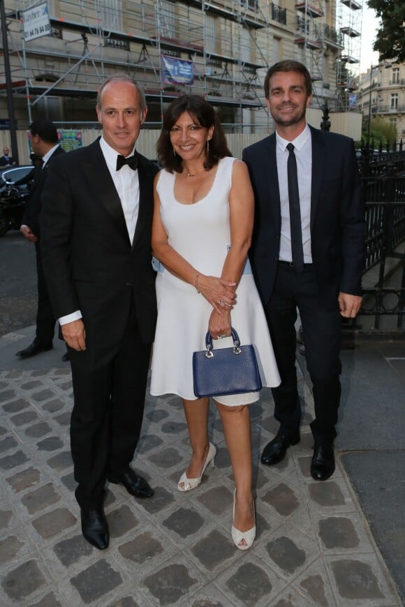 Xavier Romatet, le maire de Paris Anne Hidalgo et (son adjoint chargé de la culture) Bruno Julliard arrivent au Palais Galliera pour assister au deuxième gala de la Vogue Paris Foundation. Paris, le 6 juillet 2015.