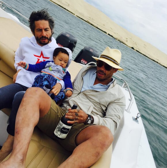 JoeyStarr en vacances avec son fils Marcello (7 mois) à la dune du Pyla - juillet 2015