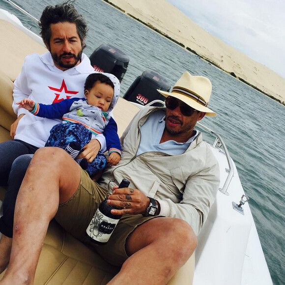 JoeyStarr en vacances avec son fils Marcello (7 mois) à la dune du Pyla - juillet 2015