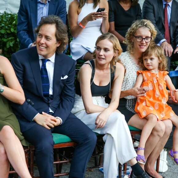 David Lauren (fils de Ralph Lauren) et Diane Kruger lors du défilé Polo Ralph Lauren (collection enfant automne-hiver 2015-2016) au zoo de Central Park. New York, le 5 août 2015.
