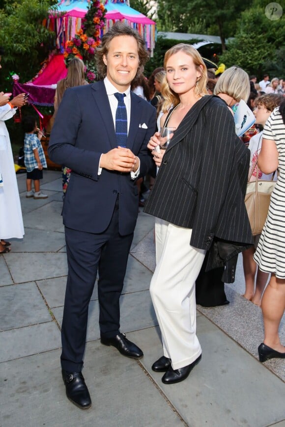 David Lauren (fils de Ralph Lauren) et Diane Kruger lors du défilé Polo Ralph Lauren (collection enfant automne-hiver 2015-2016) au zoo de Central Park. New York, le 5 août 2015.