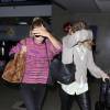 Mary-Kate et Ashley Olsen à l'aéroport LAX de Los Angeles. Juillet 2014.