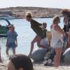 Exclusif - Le joueur du PSG Gregory Van Der Wiel et sa petite amie en vacances, à Ibiza, le 9 août 2015.