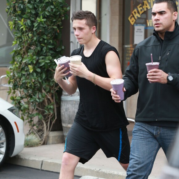 David, Victoria et Brooklyn Beckham à la sortie de leur cours de Soul Cycle à Brentwood, le 20 aout 2015