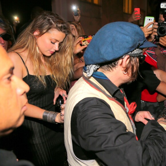 Johnny Depp et Amber Heard quittent le Rock in Rio où se produisaient les Hollywood Vampires, Rio de Janeiro, le 24 septembre 2015.