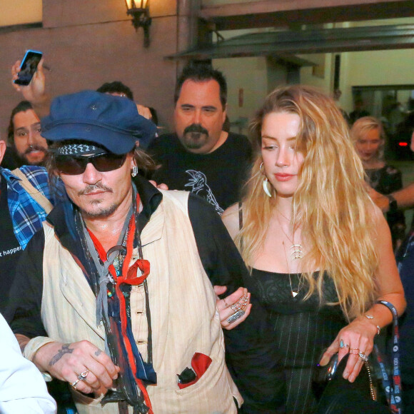 Johnny Depp et Amber Heard quittent le Rock in Rio où se produisaient les Hollywood Vampires, Rio de Janeiro, le 24 septembre 2015.