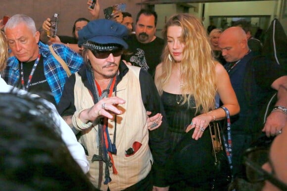 Johnny Depp et Amber Heard quittent le Rock in Rio où se produisaient les Hollywood Vampires, Rio de Janeiro, le 24 septembre 2015.