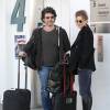 Renee Zellweger et son compagnon Doyle Bramhall II arrivent a l'aeroport LAX de Los Angeles pour prendre un avion. Le 10 fevrier 2013