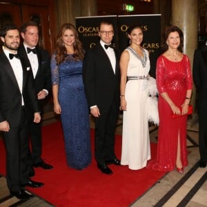 La princesse Victoria et la princesse Madeleine de Suède, enceinte de la princesse Leonore, en décembre 2013 lors d'un gala à Stockholm pour les 70 ans de la reine Silvia.