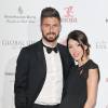Olivier Giroud et sa femme Jennifer, enceinte, sur le tapis rouge de la 6e édition de la soirée du Global Gift Gala à l'hôtel Four Seasons de Londres, le 30 novembre 2015
