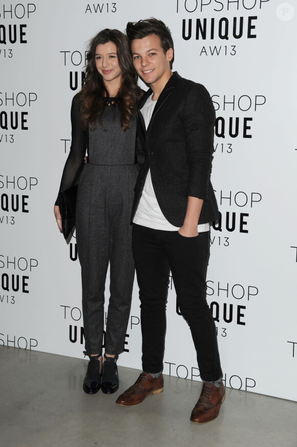 Louis Tomlinson et Eleanor Calder - People arrivant au defile Topshop pendant la Fashion Week de Londres, le 17 fevrier 2013.