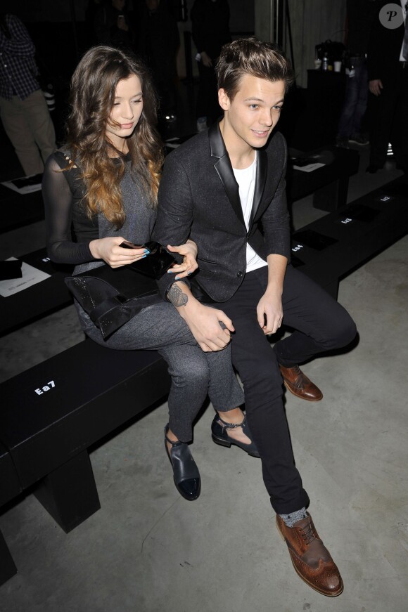 Louis Tomlinson et sa petite amie Eleanor Calder - Defile Topshop pendant la Fashion Week de Londres, le 17 fevrier 2013.