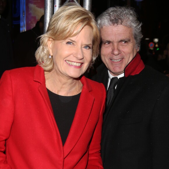 Catherine Ceylac et son mari Claude Serillon arrivent à l'avant-première du film 'The Monuments men' à l'UGC Normandie sur les Champs-Elysées à Paris le 12 Février 2014.