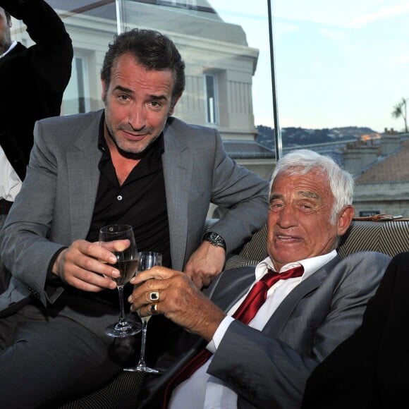 Exclusif - Jean Dujardin, Jean-Paul Belmondo - Soirée de Gala caritative au profit de l'association "Des Cantines Scolaires pour les Enfants du Sahel" à Cannes au Five Seas Hotel, le 31 mai 2014.